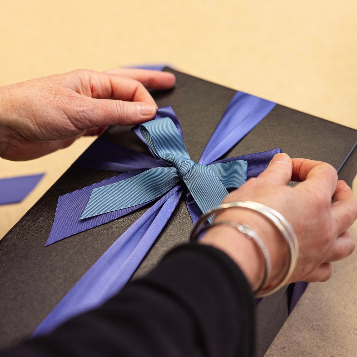 Gift Box with Purple and Blue Ribbons