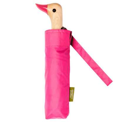 Pink umbrella with wooden handle on a white background